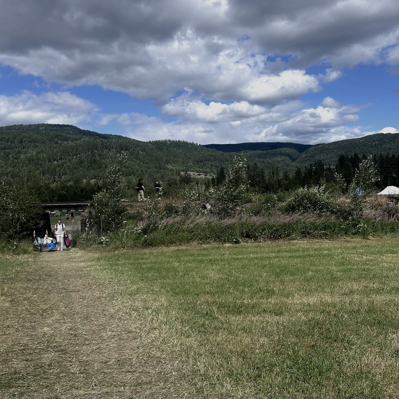 Arriving at the festival meadow beneath the mountains